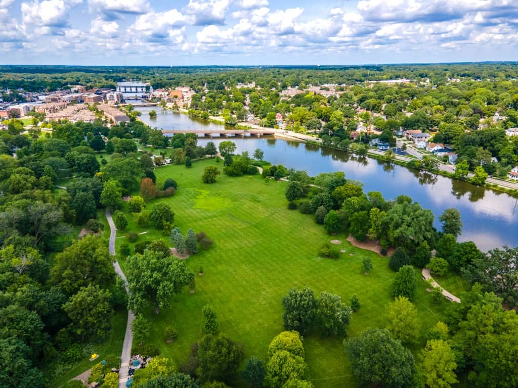 Aerial view of St Charles Illinois riverfront park and Fox River with surrounding neighborhoods and bridges